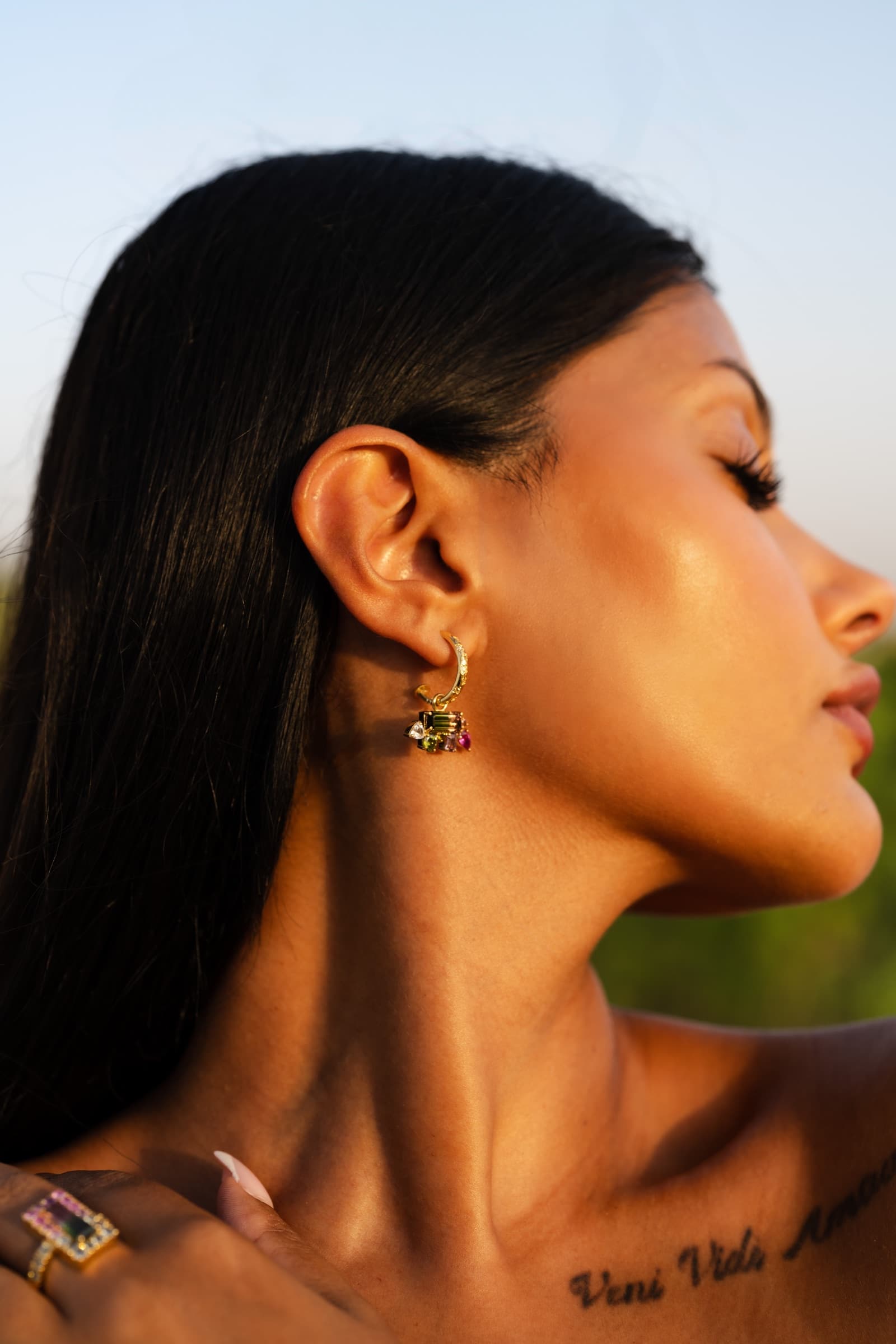 Tourmaline drop earrings and the watermelon cocktail ring, worn at golden hour