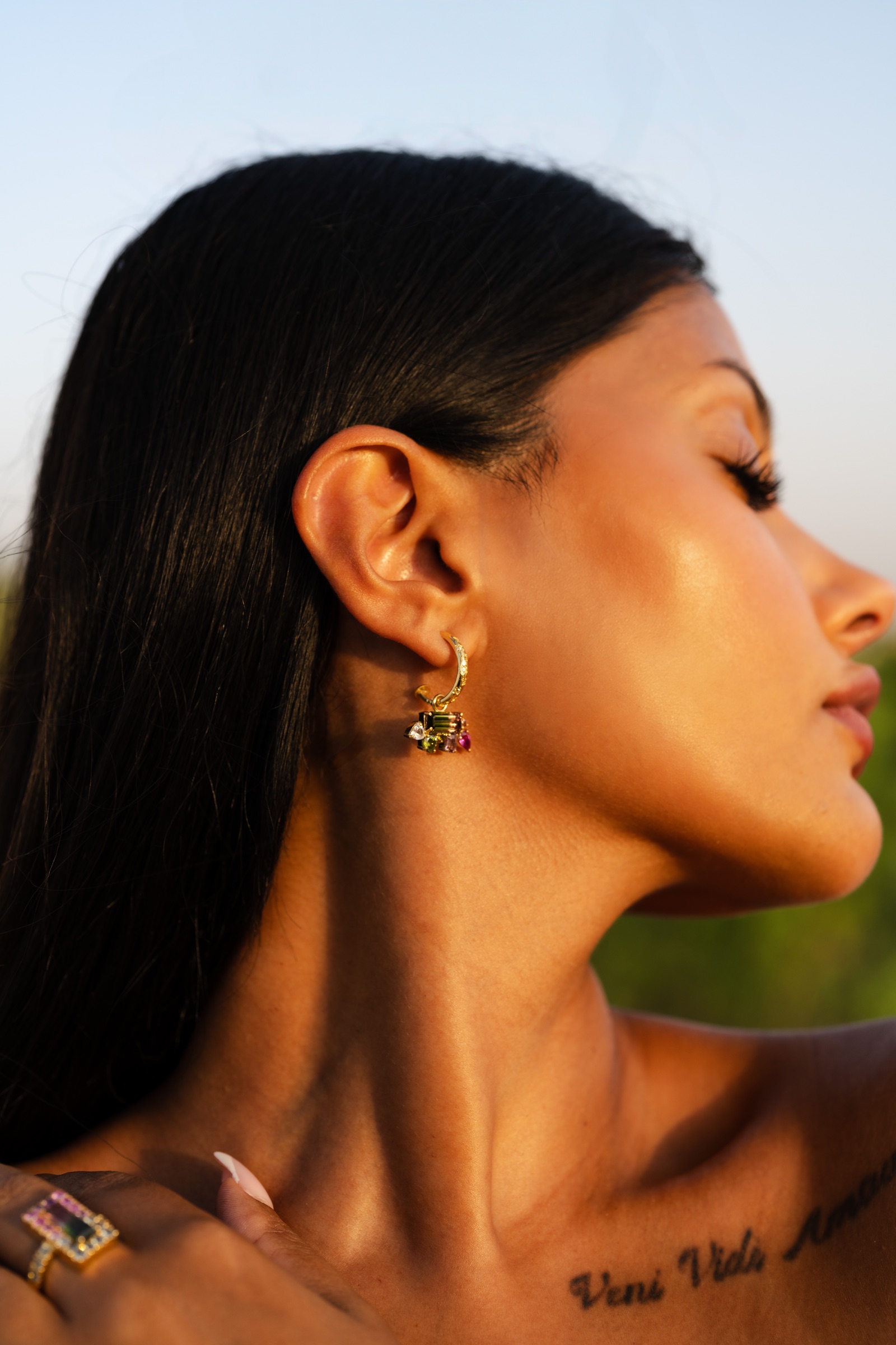 Tourmaline drop earrings and the watermelon cocktail ring, worn at golden hour